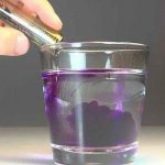 diluting potassium permanganate in a glass